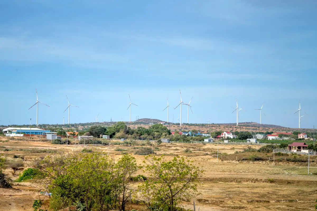 Wind turbines generating renewable energy in a rural landscape